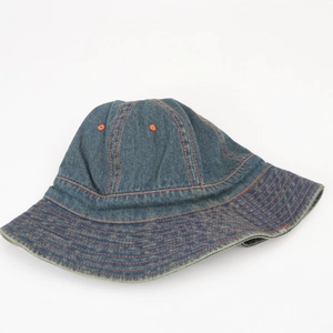 Detailed shot of dark blue denim bucket hat with contrasting orange stitching