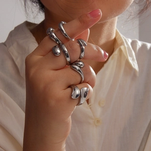 Polished silver organic water drop rings set with minimalist 18K gold plated finish