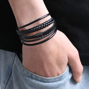 Layered black leather woven bracelet for men with magnetic clasp on a wrist model
