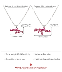 Detailed dimensions of pink rhinestone AK-47 rifle pendants with zinc alloy chain
