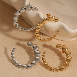 Fashionable C-shaped stainless steel earrings featuring a linked heart pattern in gold and silver
