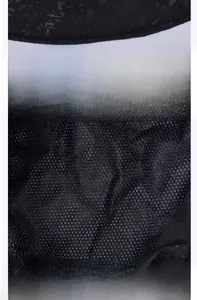 Detail view of the breathable diamond mesh lining on a black sun protection bucket hat