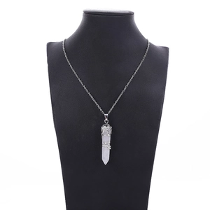 Silver dragon wrap necklace with hexagonal white crystal pillar pendant on mannequin