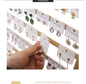 Detail view of 0.4cm thick wooden horizontal bars on a multi-layer earring display rack