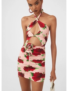 Detail of pink rose print halter dress featuring 3D fabric flowers and waist cutout