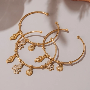 18k gold plated stainless steel open bangles with shell, conch, and octopus charms