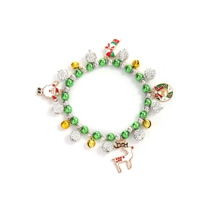 Close-up of Christmas charm bracelet with Santa, reindeer, and colorful festive beads