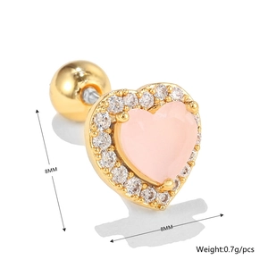 Macro detail of 8mm pink heart earring with gold frame and cubic zirconia stones