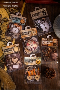 Detailed close-up of vintage DIY hard card stickers for journaling and scrapbooking