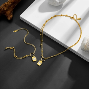 Gold double-layer stainless steel necklace and bracelet set with white shell butterfly pendant