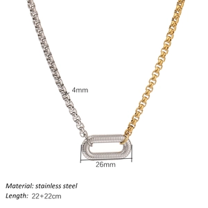 Two-tone stainless steel link necklace with 18K gold plating and ribbed oval ring detail