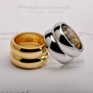 Polished 18K gold and silver wide band stainless steel rings in a minimalist style