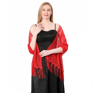 Detail of red hollow lace shawl featuring intricate floral patterns and long fringe tassels