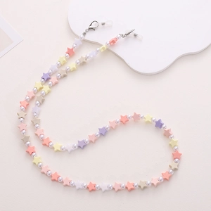 Detail of colorful star beads and white pearls on a stylish eyewear and mask chain