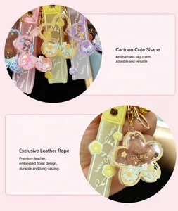 Close-up detail of cute acrylic cherry blossom quicksand keychain with lucky charm strap