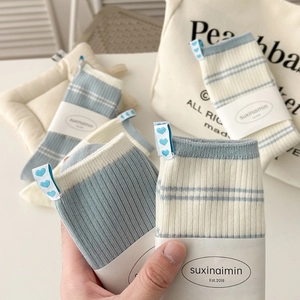 Baby blue striped ribbed cotton socks with heart woven labels for women in soft casual style