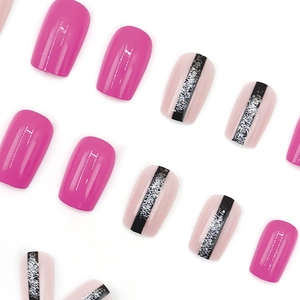 Hot pink square press-on nails with black glitter stripe accent on white background