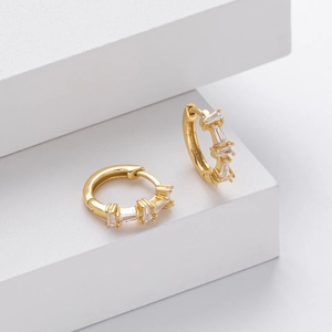 Elegant gold S925 sterling silver hoop earrings featuring three baguette cut zircons