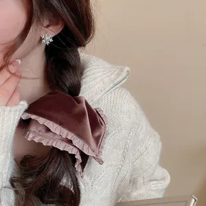 Elegant brown velvet bow hair scrunchie with pink lace and sparkling snowflake stud earrings