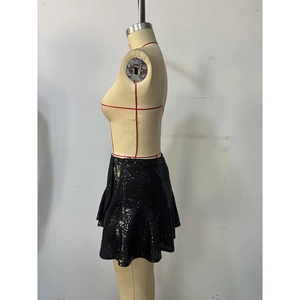 Detail showing tiered black sequin layers and side zipper of the mini A-line skirt