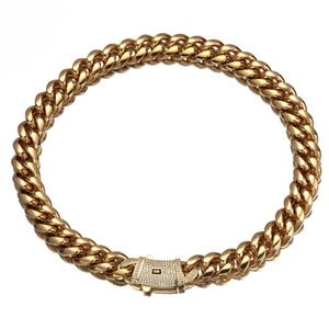 Polished gold-plated cuban link bracelet with sparkling zircon studded clasp on white background