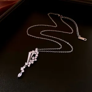 Silver hourglass waterdrop pendant necklace with white zircon on a black leather tray