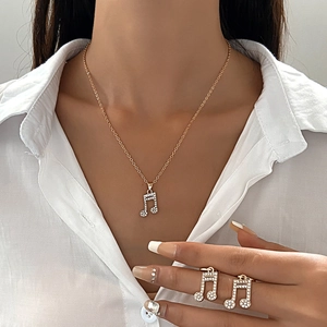 Elegant gold musical note jewelry set with sparkling rhinestones for women
