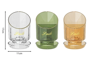 Three transparent striped makeup brush holders in clear, green, and amber with dimensions