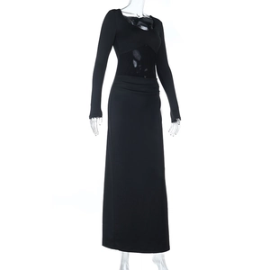 Detail view of mesh patchwork and ruched ruffles on a black bodycon maxi dress