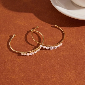 18k gold plated stainless steel open bangle with seven heart-shaped zircon stones