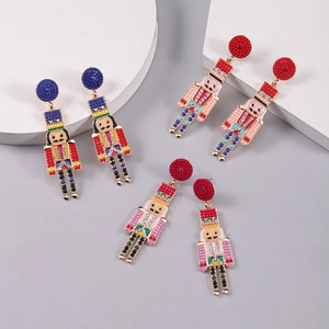 Detail of nutcracker earrings featuring vibrant enamel and sparkling crystal accents