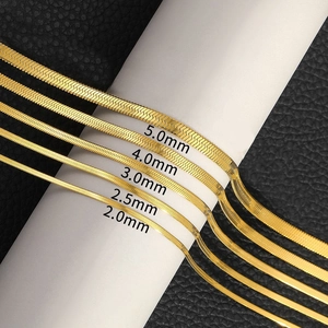 Flat gold stainless steel snake chains shown in 2.0mm to 5.0mm widths on black leather