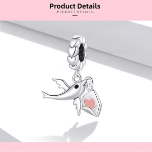 Detail of S925 silver bird charm with pink enamel heart envelope and heart-shaped bail