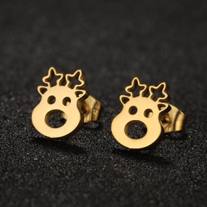 Golden reindeer stud earrings with star-shaped antlers on a textured black surface