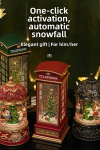 Close-up of Christmas phone booth music box with glowing LED lights and swirling snow