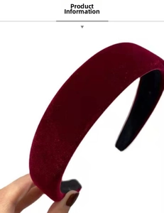 Detail of a thick vintage burgundy velvet headband with anti-slip black inner lining