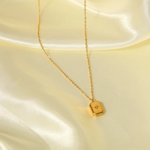 Golden 18k plated stainless steel square pendant necklace with starburst and center crystal
