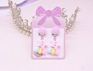 Detailed view of pink glitter star and colorful raindrop charms for kids ear clips