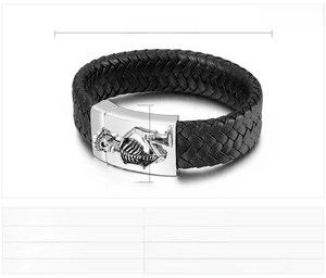 Close-up of men's leather braided bracelet with stainless steel skull clasp details
