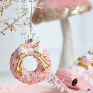 Pink Christmas wreath ornament with white bow and gold beads for festive tree decoration