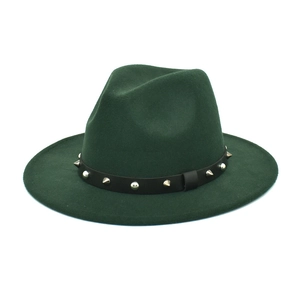 Close-up of the dark green wool fedora hat featuring a studded leather band and silver rivets