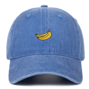 Close-up of navy washed cotton baseball cap with yellow banana embroidery detail