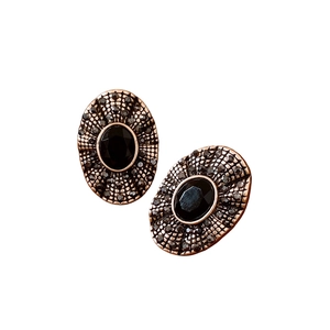 Vintage bronze oval stud earrings featuring black crystal pave and a retro court style