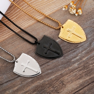 Shield pendant necklaces in gold, black, and silver with cross and scripture engraving