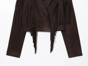 Detail of premium brown faux suede jacket featuring vintage western-style fringe trim