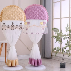 Detail view of lace trim and quilted embroidery on decorative electric fan covers