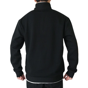 Rear view of men's black quarter-zip sweatshirt showing textured waffle knit fabric details