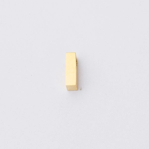 Macro shot of 1.8mm hole golden letter bead with mirror polished stainless steel surface