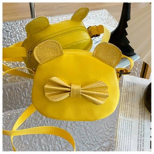 Close-up of a yellow PU leather kids crossbody bag with sequin bow and cartoon ears
