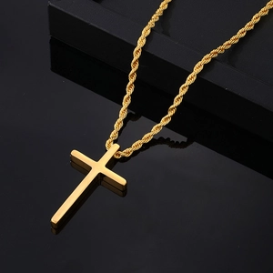 Polished gold stainless steel cross pendant necklace with rope chain on black background